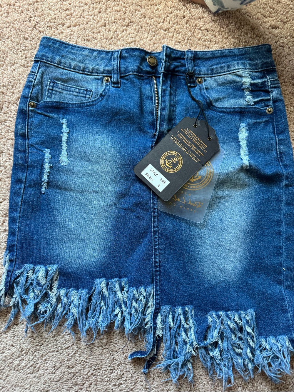 Distressed Blue Denim Mini Skirt with Frayed Hem